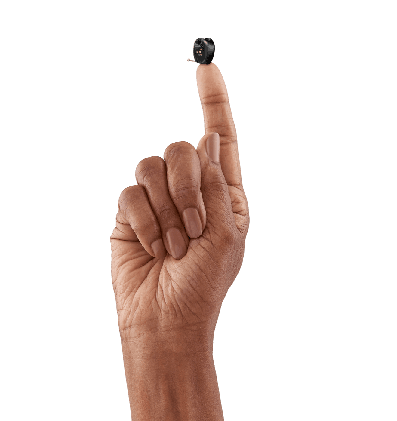 A completely-in-canal hearing aid balanced on a fingertip, showing how small it is