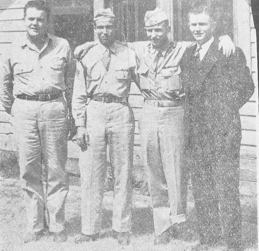 Four soldiers posed together, 1940s