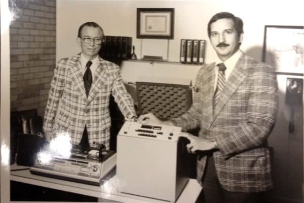 Richard Davila Sr. and colleague with early audiological equipment, 1976